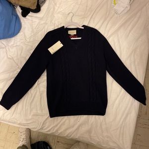 Authentic blue Guuci pullover. Size L. Never been worn, tags still on.